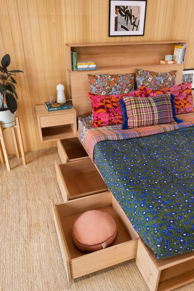 handemade in australia wood bed with drawers and flowting attached sidetable