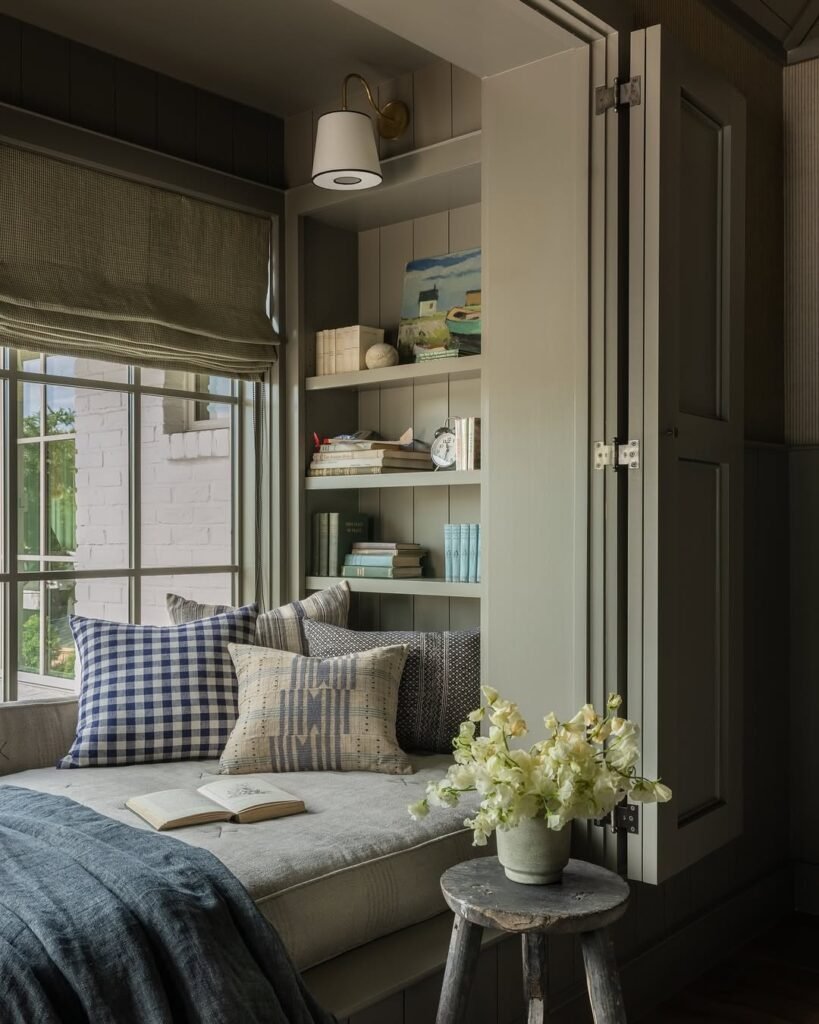 a bedroom with a seating area:reading nook