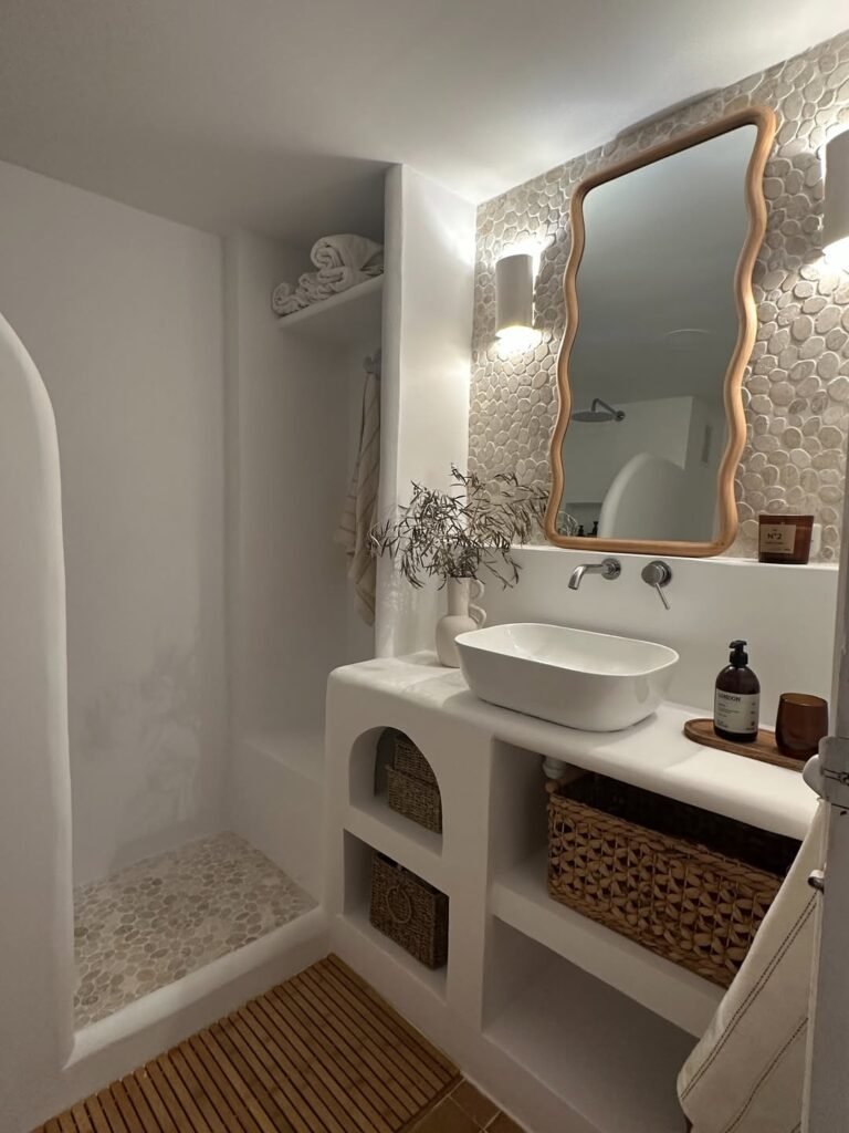 beautiful white painted greek style bathroom with tiles
