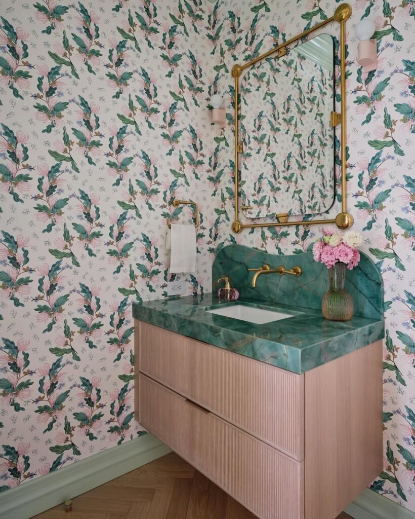 bewatiful powder room with floral wallpaper and green marble stone vanity