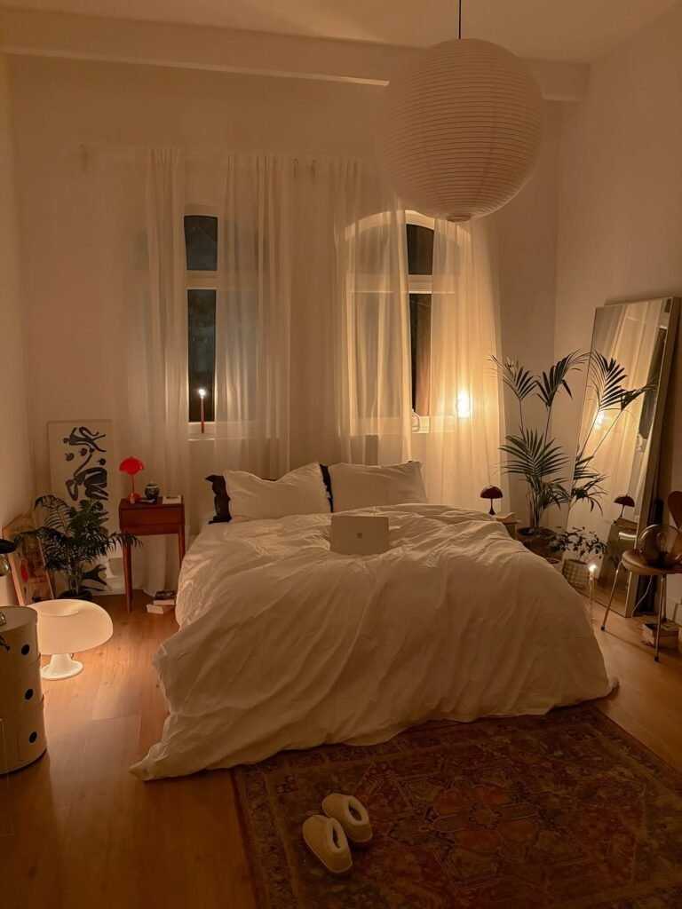 cozy elegent boho style bedroom with warm layered lighting