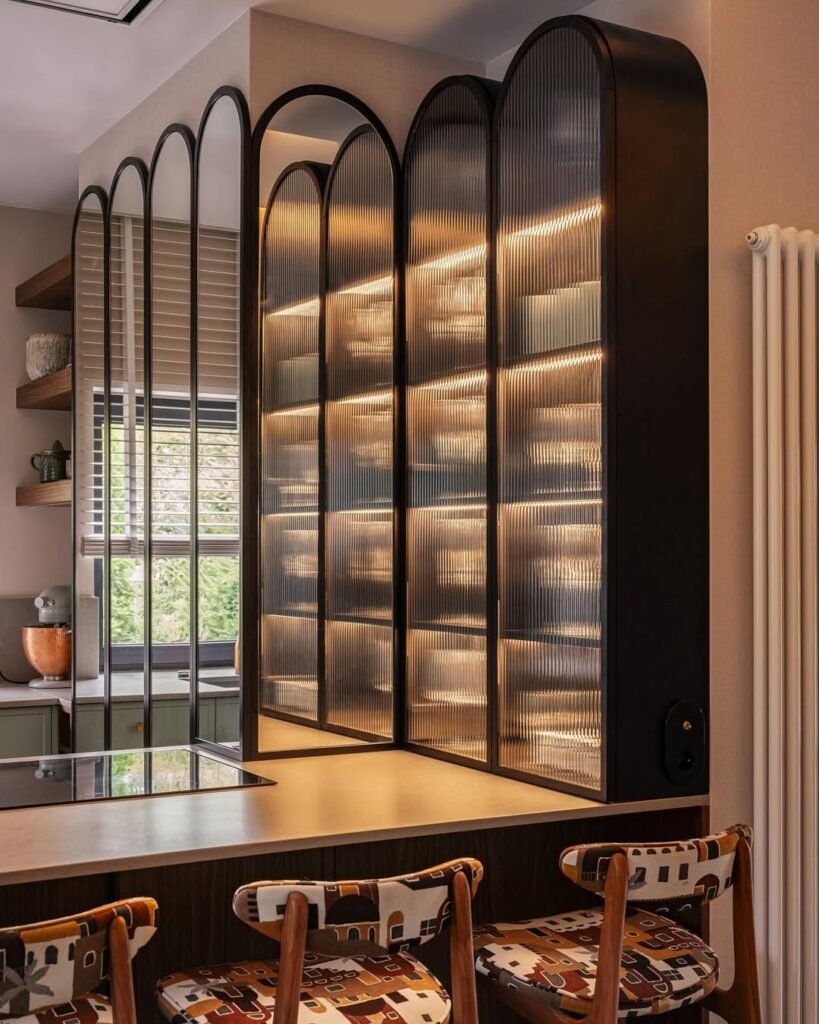 kitchen with double sided peninsula and glass cabinets and shelves