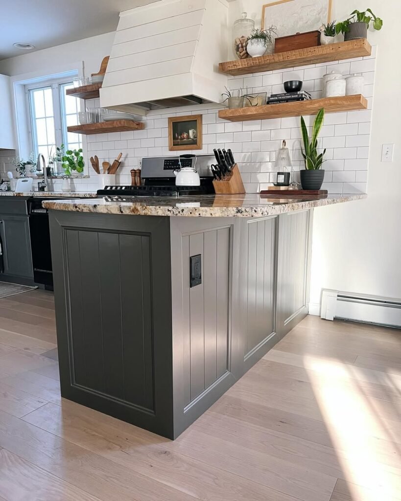 kitchen with double sided peninsula with wood floating shelves